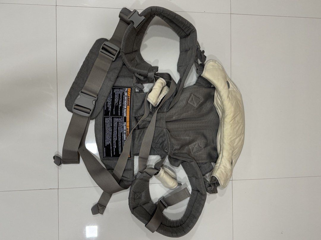 Graco Grey Mesh Baby Carrier (Category: Carriers & Slings) located in Calamba. Submitted by sofiesmerch (Listing ID 1466206226, Image 2). Description: - Brand: Graco - Color: Grey with cream-colored head support - Weight capacity: Suitable for infants 8 to 35 lbs - Breathable mesh panel for optimal airflow - Comfortable padded shoulder straps and secure adjustable buckles - Includes clear safety warning label on the back - Gently used and well-ma
