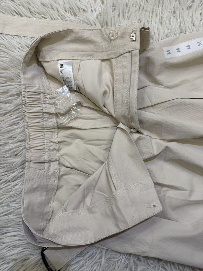 GU Belted Wide Pants Beige Size M (Category: Jeans) located in Manila. Submitted by kristinata44809 (Listing ID 1466176451, Image 3). Description: - Brand: GU - Item: Belted wide pants - Color: Beige - Size: M (Waist 66cm) - Condition: Brand new with tags (BNWT), unworn - Details: High-waisted style, pleated front, matching fabric belt included - Extras: Original spare button attached inside.