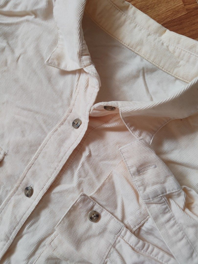 GU Cream Corduroy Button-Down Overshirt (Category: Coats, Jackets and Outerwear) located in San Pablo. Submitted by greatfindsspc (Listing ID 1466209116, Image 3). Description: Add a cozy, textured layer to your everyday look with this classic GU corduroy button-down shirt. Featuring a soft, fine-wale corduroy fabric in a versatile cream/off-white shade, this piece works perfectly as a standalone button-down shirt or styled open as a lightweight 