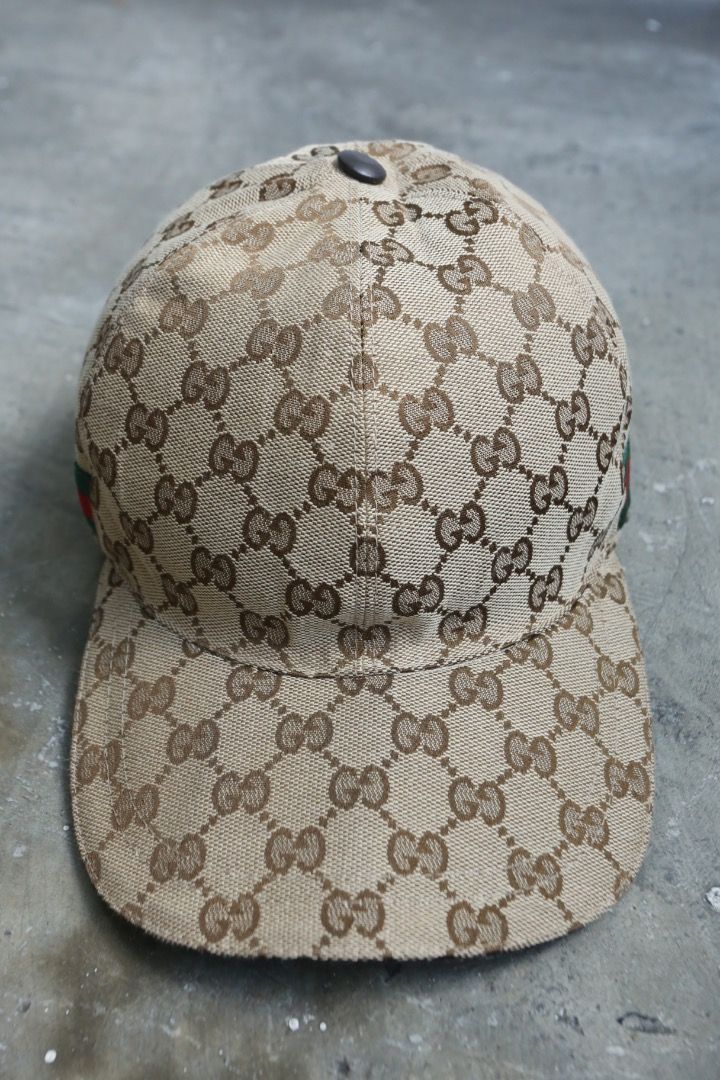 Gucci - GG Baseball Cap (Category: Caps & Hats) located in Manila. Submitted by graymatter_ (Listing ID 1466235360, Image 3). Description: Gucci - GG Baseball Cap Tagged Size: S Condition: 9/10 Flaws: Cut Side Tags Material: Coated Canvas, Leather Made in: Italy Dimensions 57cm.