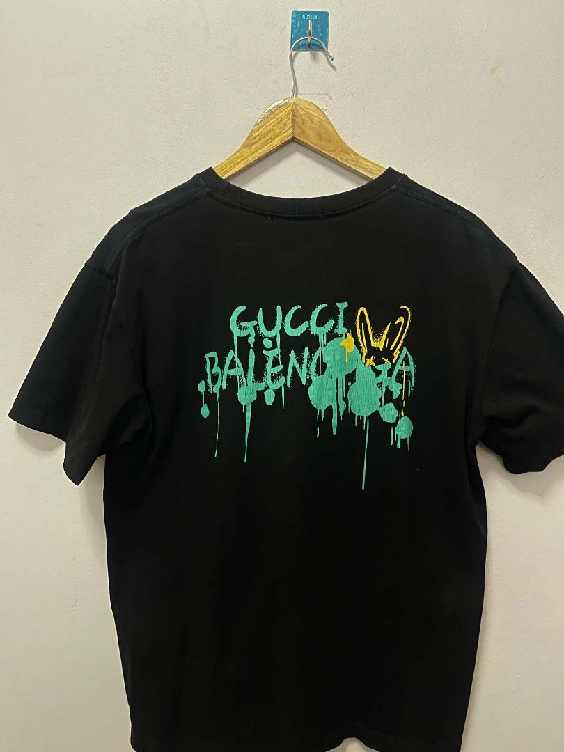 Gucci Balenciaga Hacker Project Graffiti Tee Black (Category: Tshirts & Polo Shirts ) located in Manila. Submitted by gregorioju41138 (Listing ID 1466261985, Image 2). Description: - Color: Black - Material: 100% Cotton, soft and breathable - Fit: Regular fit with crew neck - Design: Eye-catching graffiti graphics with green and yellow spray paint effect on front and back - Back Detail: Exclusive collaboration design text - Condition: Excellent, 