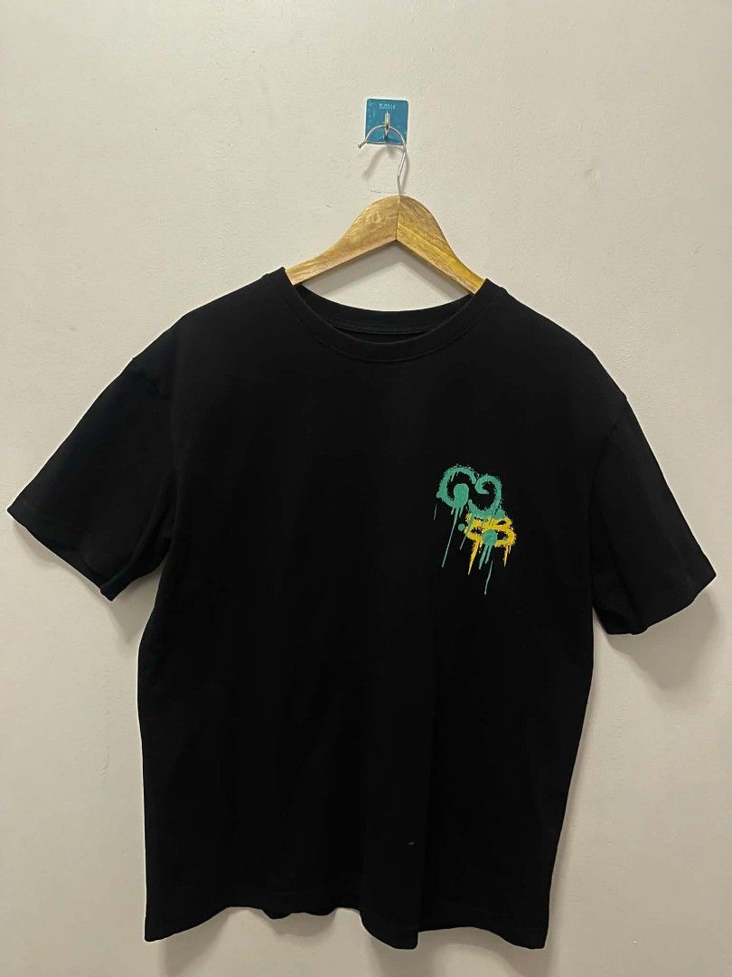 Gucci Balenciaga Hacker Project Graffiti Tee Black (Category: Tshirts & Polo Shirts ) located in Manila. Submitted by gregorioju41138 (Listing ID 1466261985, Image 1). Description: - Color: Black - Material: 100% Cotton, soft and breathable - Fit: Regular fit with crew neck - Design: Eye-catching graffiti graphics with green and yellow spray paint effect on front and back - Back Detail: Exclusive collaboration design text - Condition: Excellent, 