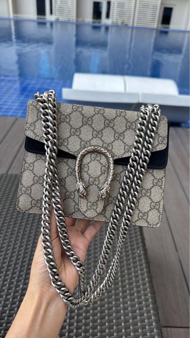 Gucci Dionysus GG mini (Category: Luxury Bags & Wallets) located in Taguig. Submitted by byebyebabies (Listing ID 1466311767, Image 2). Description: - Authentic Gucci Dionysus shoulder bag - Crafted in iconic GG Supreme canvas with black suede trim - Features the signature antique silver-tone tiger head closure - Chunky sliding chain strap for versatile wear (shoulder or crossbody) - Structured, elegant shape with premium heavy hardware - Guarant