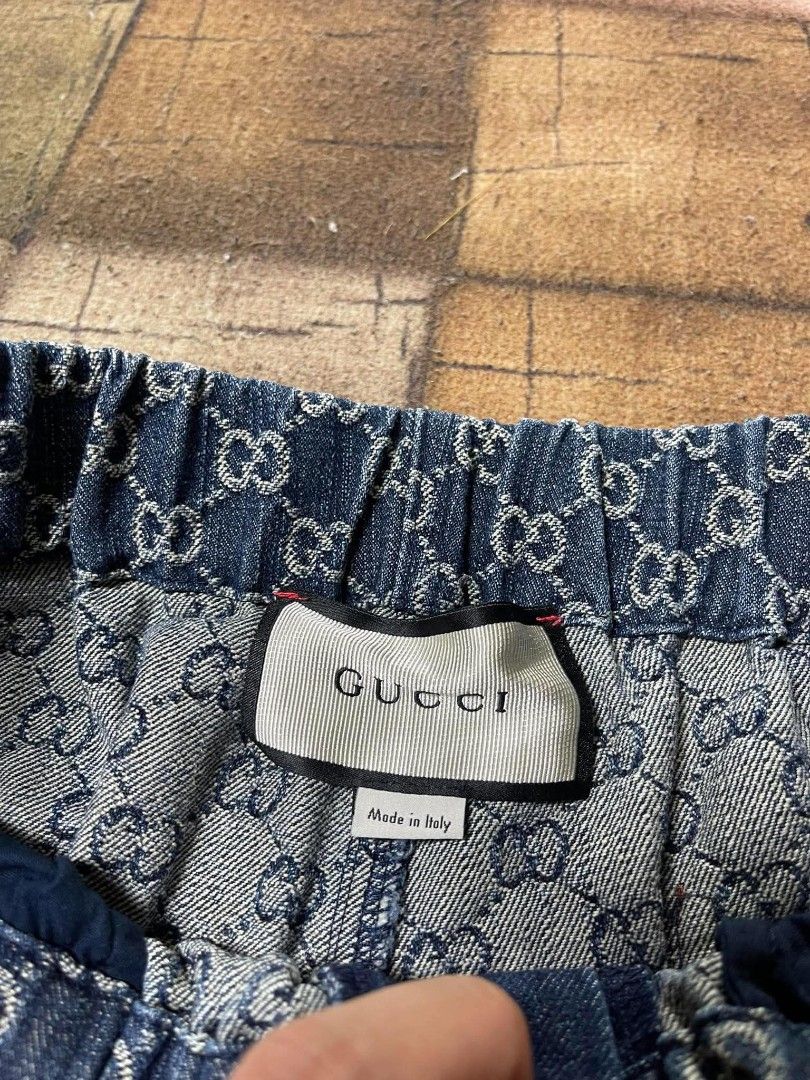 Gucci GG Denim Shorts Size 52 (Category: Shorts) located in Manila. Submitted by japee55 (Listing ID 1466266242, Image 3). Description: - Brand: Gucci - Style: Denim shorts with classic GG monogram pattern - Size: 52 (Made in Italy) - Waistband: Elastic for a comfortable fit - Pockets: Two front and two back pockets with brown leather accents - Condition: Great piece for warm weather styling.