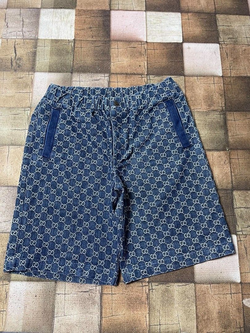 Gucci GG Denim Shorts Size 52 (Category: Shorts) located in Manila. Submitted by japee55 (Listing ID 1466266242, Image 1). Description: - Brand: Gucci - Style: Denim shorts with classic GG monogram pattern - Size: 52 (Made in Italy) - Waistband: Elastic for a comfortable fit - Pockets: Two front and two back pockets with brown leather accents - Condition: Great piece for warm weather styling.