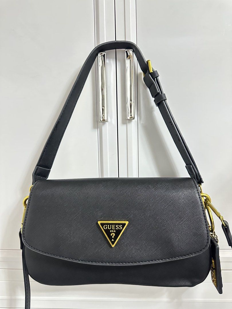 Guess Shoulder/Sling Bag (Category: Shoulder Bags) located in Quezon City. Submitted by jeydeegmr (Listing ID 1466310142, Image 1). Description: Selling my preloved guess bag. 2in1 shoulder or sling bag.