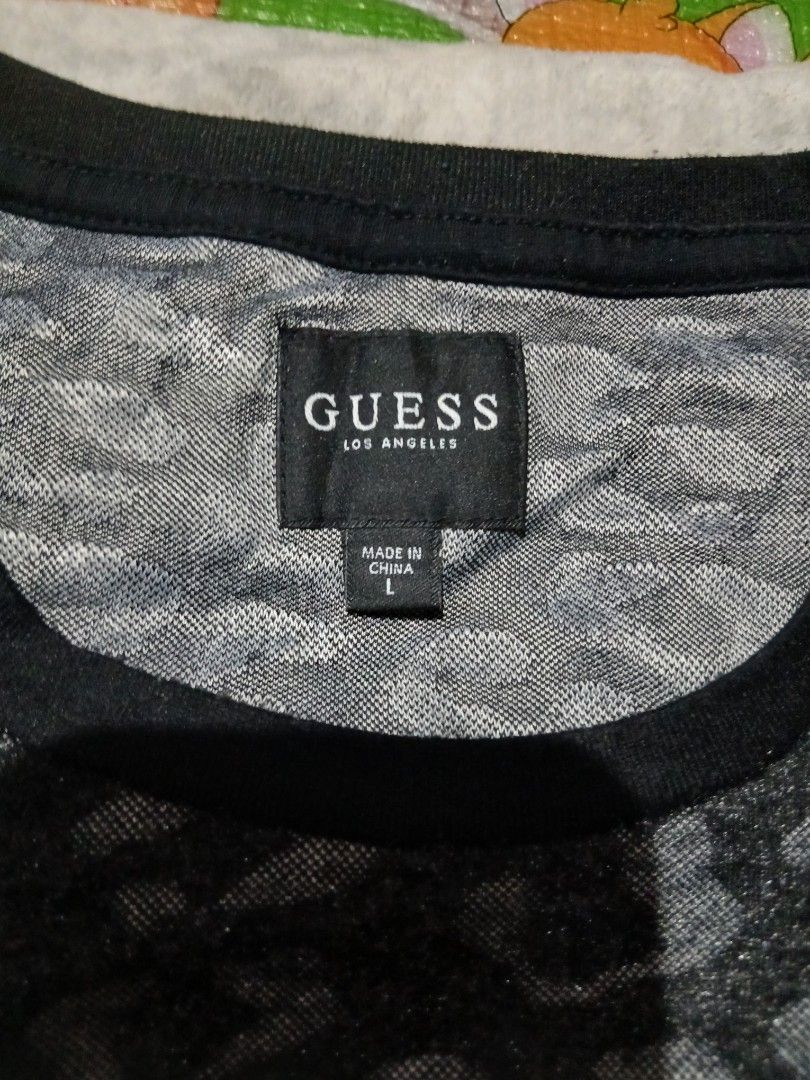 Guess tshirt (Category: Tshirts & Polo Shirts ) located in Iriga City. Submitted by newbear-a710 (Listing ID 1466280740, Image 2). Description: Excellent Condition Large on tag Need wash.