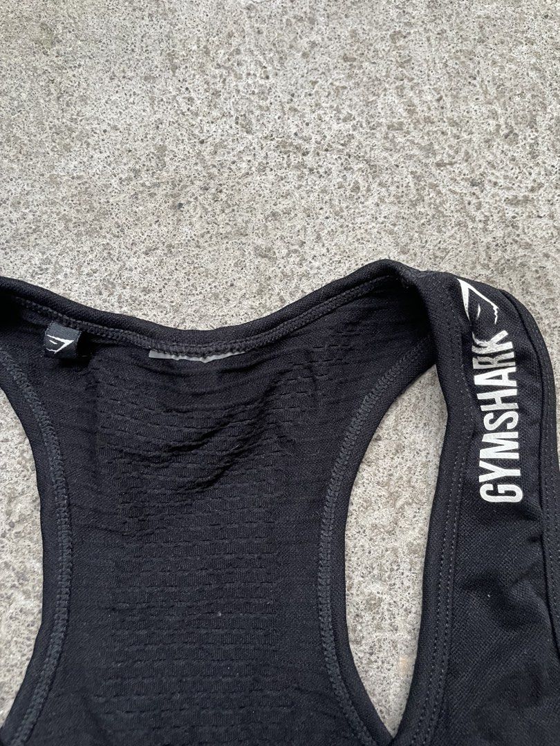 Gymshark Black Seamless Tank Top (Category: Activewear) located in Siniloan. Submitted by rethr1ft (Listing ID 1466245170, Image 3). Description: - 24 length | 14 width - Authentic Gymshark activewear tank top in classic black - Racerback design with white logo lettering on the shoulder strap - Built-in inner lining provides extra coverage and support during workouts - Stretchy, breathable seamless fabric featuring stylish contour knit patterns -