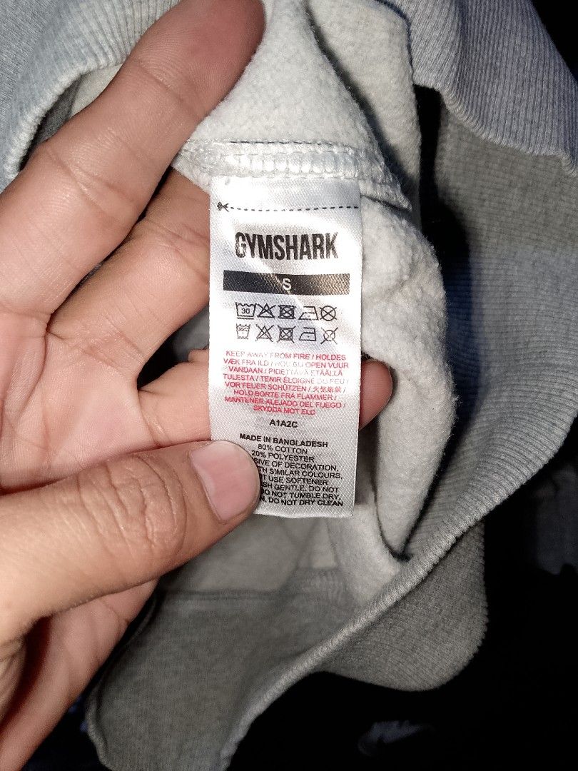 Gymshark Grey Sweatshirt Size S (Category: Coats, Jackets and Outerwear) located in Manila. Submitted by mjthrifted_second (Listing ID 1466207570, Image 2). Description: - Brand: Gymshark - Style: Classic crewneck pullover sweatshirt - Size: Small -Dimes: 21/27.5 - Color: Grey with small embroidered white chest logo - Material: Comfortable cotton and polyester blend - Details: Long sleeves with ribbed cuffs and hem - Condition: Pre-loved, well-ma