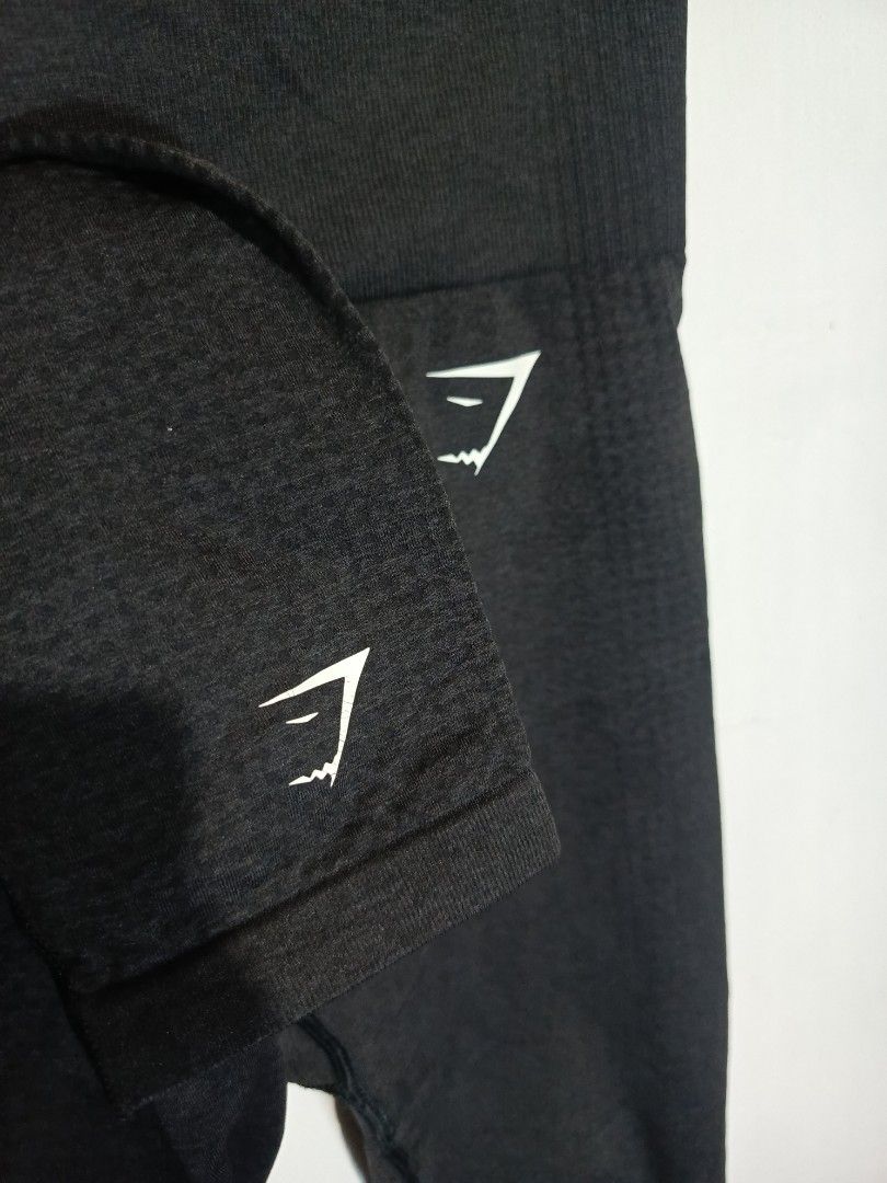 GYMSHARK SEAMLESS LEGGINGS (Category: Activewear) located in Baguio. Submitted by 074thriftmania (Listing ID 1466255007, Image 3). Description: - Brand: Gymshark - Item: Black seamless leggings - Size: Medium - Fit: High-waisted with supportive ribbed waistband - Details: Iconic Gymshark logo near hip and lower leg - Material: 55% nylon, 33% polyester, 12% elastane - Condition: Wash tag intact, great for workouts or daily wear.