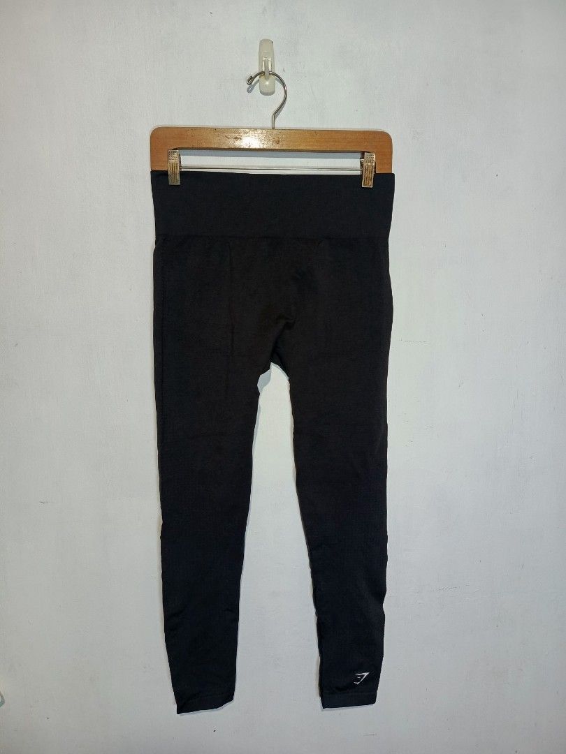 GYMSHARK SEAMLESS LEGGINGS (Category: Activewear) located in Baguio. Submitted by 074thriftmania (Listing ID 1466255007, Image 2). Description: - Brand: Gymshark - Item: Black seamless leggings - Size: Medium - Fit: High-waisted with supportive ribbed waistband - Details: Iconic Gymshark logo near hip and lower leg - Material: 55% nylon, 33% polyester, 12% elastane - Condition: Wash tag intact, great for workouts or daily wear.