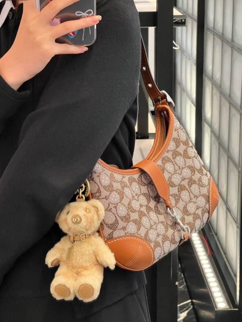 Hamptons Crystals Coach (Category: Shoulder Bags) located in Manila. Submitted by liahsells (Listing ID 1466317647, Image 2). Description: - Authentic Coach shoulder bag in signature brown monogram canvas - Embellished all over with tiny crystals for a subtle, elegant shine - Premium smooth tan leather trim and reinforced corners - Silver-tone hardware featuring a stylish front dog leash clasp detail - Comfortable single shoulder strap with adjus