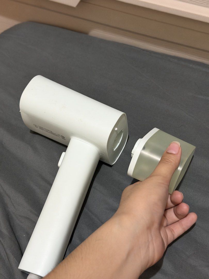 Handheld Portable Garment Steamer (Category: Irons & Steamers) located in Bocaue. Submitted by pat.staines (Listing ID 1466199100, Image 1). Description: - Color: light blue green - Compact and travel-friendly design - Heats up fast, no heating issues! - Press button for steam, pag di nakapress mainit parin naman wala lang steam issue: ung sa plate nya may gasgas and chipping pero it doesn't affect anything sa performance and it doesn stain sa cl