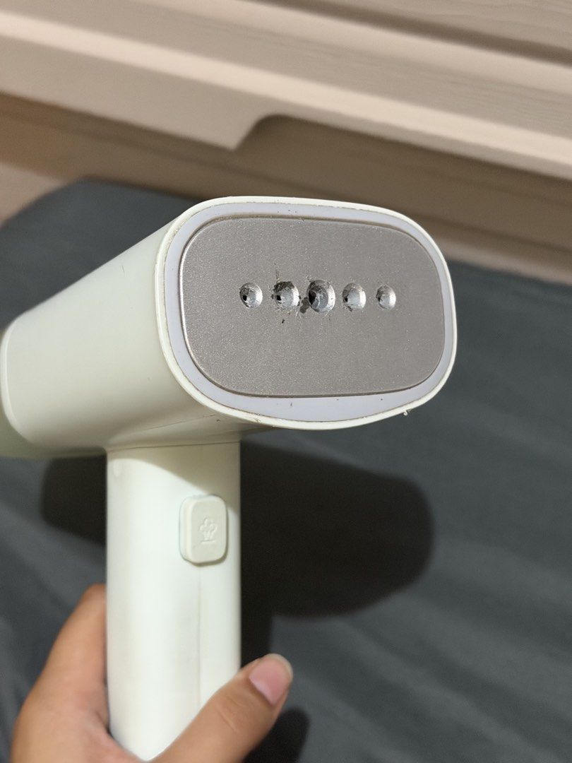 Handheld Portable Garment Steamer (Category: Irons & Steamers) located in Bocaue. Submitted by pat.staines (Listing ID 1466199100, Image 2). Description: - Color: light blue green - Compact and travel-friendly design - Heats up fast, no heating issues! - Press button for steam, pag di nakapress mainit parin naman wala lang steam issue: ung sa plate nya may gasgas and chipping pero it doesn't affect anything sa performance and it doesn stain sa cl