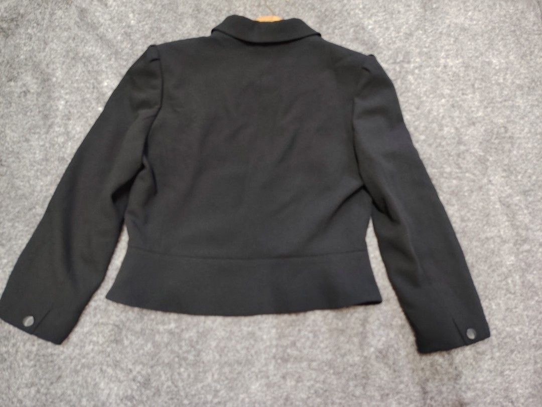 Hardy Amies London black coat MEDIUM (Category: Coats, Jackets and Outerwear) located in Valenzuela. Submitted by anna.banana10 (Listing ID 1466165918, Image 3). Description: - Brand: Hardy Amies London - Size: 11 - Color: Solid black with a textured feel - Style: Cropped blazer with a chic shawl collar and wide two-button hem - Details: Structured shoulders with slight gathering, fully lined interior, and a removable lace accent pin on the chest