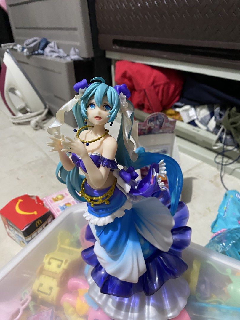 Hatsune Miku Mermaid Version Figure (Category: Figurines & Statues) located in Manila. Submitted by deniseeverafter (Listing ID 1466271059, Image 2). Description: - Authentic Hatsune Miku mermaid figure in a stunning blue and white outfit - Signature long turquoise twin tails adorned with white ribbons and purple hair bows - Elegant details including a gold-tone necklace, waist chains, and a deep blue translucent skirt - Stands beautifully on a t