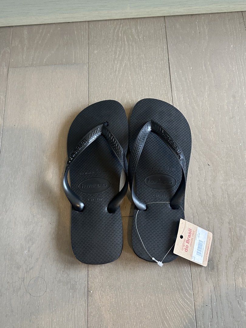 Havaianas Flip Flops Size 39/40 (Category: Slippers and slides) located in Makati City. Submitted by amarettoosour (Listing ID 1466226423, Image 1). Description: - Brand: Havaianas (Top Collection) - Color: Classic Black - Condition: Brand new, never worn with original tag attached - Size: 39/40 EUR (US 9/10W 8M) - Retail Price: PHP 949 - Features: Standard textured footbed and comfortable classic straps - Guaranteed authentic and ready to ship!.