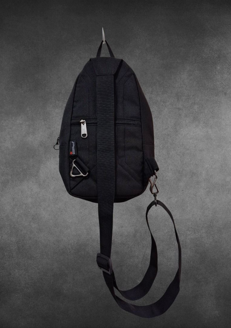 Hawk Bag Durashield Black Sling Backpack Premium Edition (Category: Sling Bags) located in Bulacan. Submitted by kei.collections (Listing ID 1466300235, Image 2). Description: - Brand: Hawk (Established 1978) - Color: Classic Black - Color Rate: 9.9/10 - Material: Durashield fabric with Viruero/Nanosilver coating - Construction: Heavy-duty lockstitch technology - Compartments: Multiple zipped compartments inside and out - Hardware: Sturdy metal h