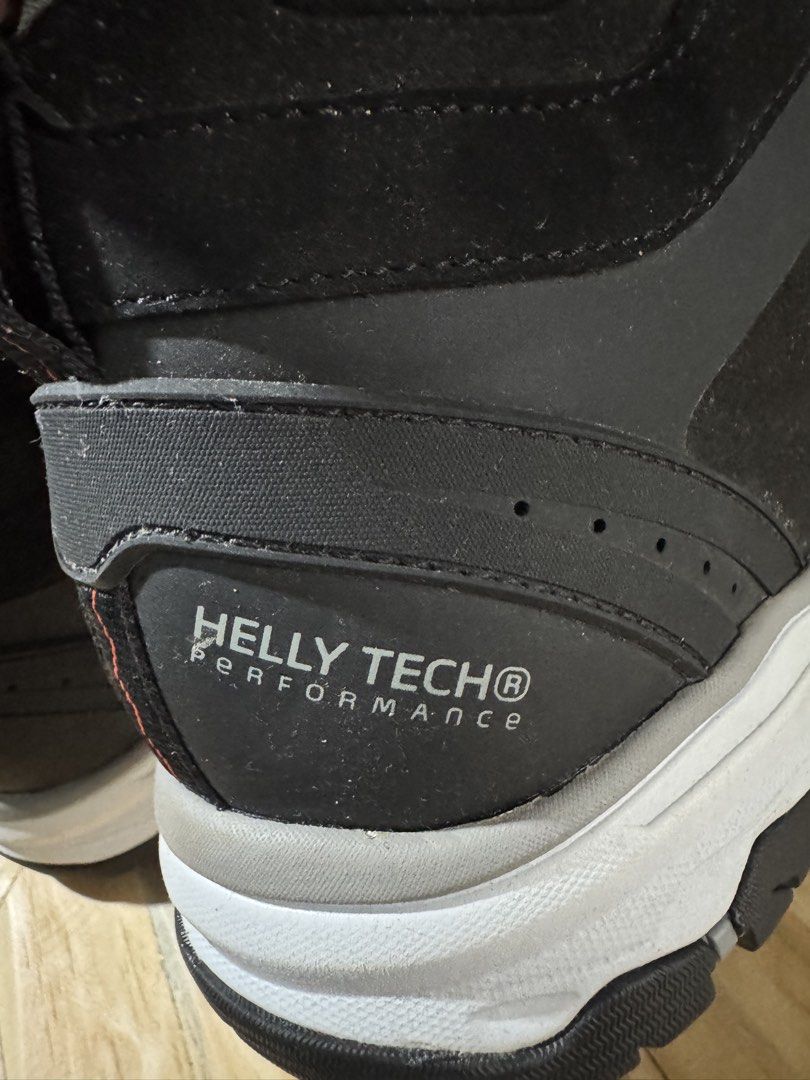 Helly Hansen Workwear BOA Safety Boots (Category: Boots) located in Cavite. Submitted by marcuz1316 (Listing ID 1466252027, Image 3). Description: Helly Hansen workwear boots in black. Helly Tech performance waterproofing. BOA dial lace system instead of standard laces. ESD protection tag attached. White and grey midsole with heavy-duty rubber grip on the bottom. Original tags still hanging off the side. High-top ankle support with breathable gre