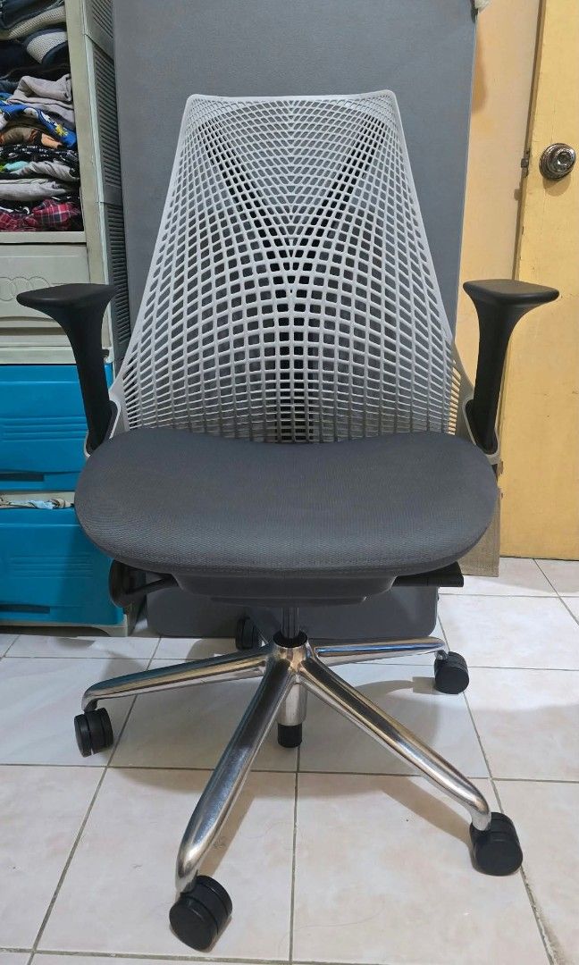 Herman Miller Sayl (Category: Chairs) located in Antipolo. Submitted by bentakahitanoano (Listing ID 1466283056, Image 2). Description: Authentic Herman Miller Sayl Chair with fixed armrests. Designed by Yves Béhar, the Sayl is known for its distinctive frameless 3D Intelligent suspension back and ergonomic design. Still in good overall condition with normal signs of use. The mesh backrest remains intact and supportive, while the padded seat is s