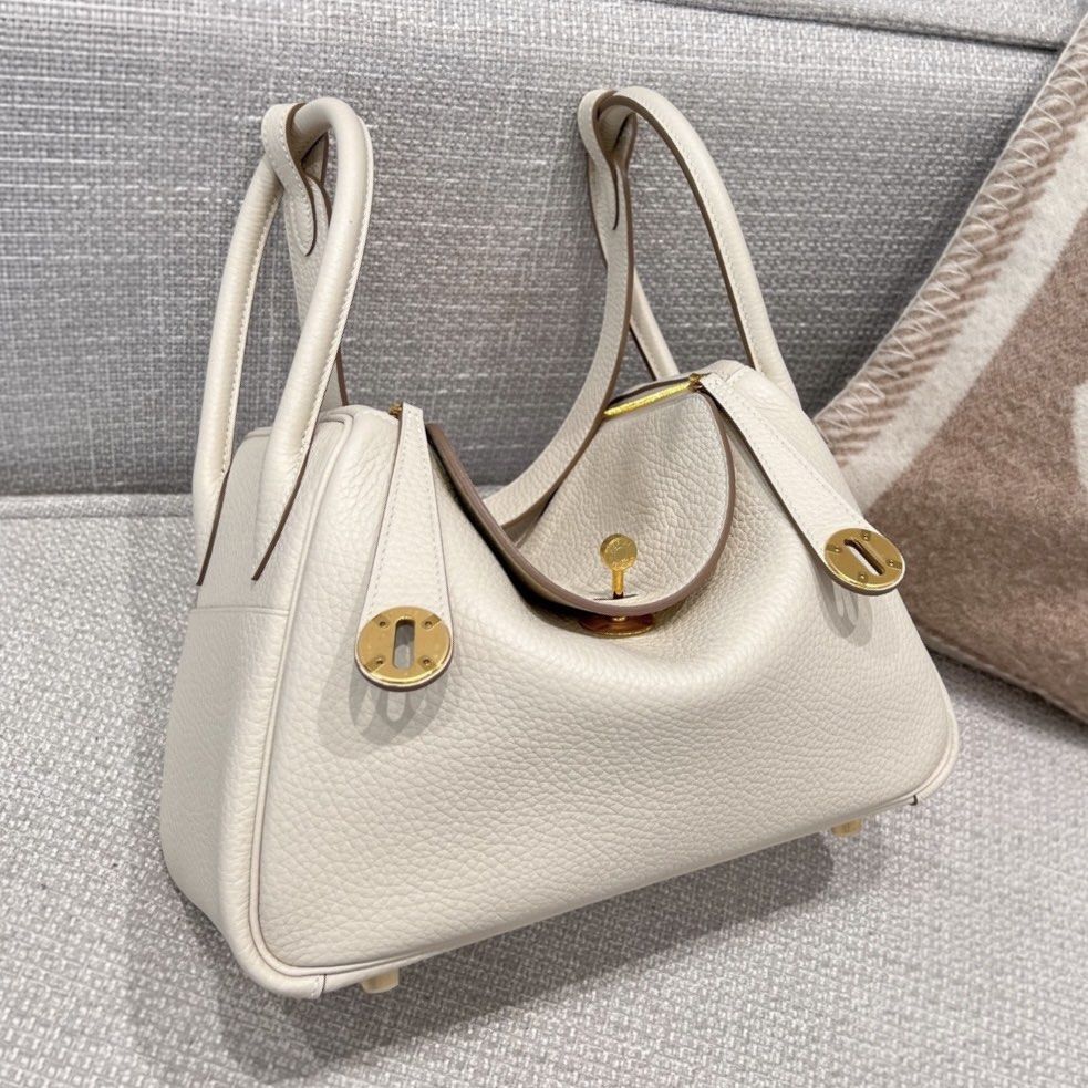 Hermes Lindy 26 Craie (Category: Luxury Bags & Wallets) located in Manila. Submitted by poppyany (Listing ID 1466189584, Image 1). Description: RUSH SALE Hermes Lindy 26 in Craie Clemence leather with gold hardware. Used once only, good as new. Stickers on hardwares are still intact. Complete inclusions. .