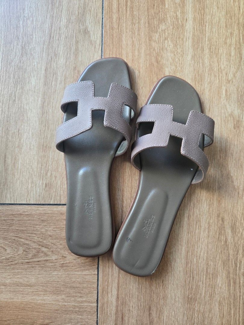 Hermes Oran Sandals (Category: Flats & Sandals) located in Marikina City. Submitted by aj.preloved (Listing ID 1466336398, Image 1). Description: Guaranteed Authentic Hermes Oran sandals in taupe calfskin leather. Fits 8.5 to 9 slim feet Heavy wear on the leather outsoles and minor scuffing on the insoles and toe edges. (see 4th photo) Price is slightly negotiable.
