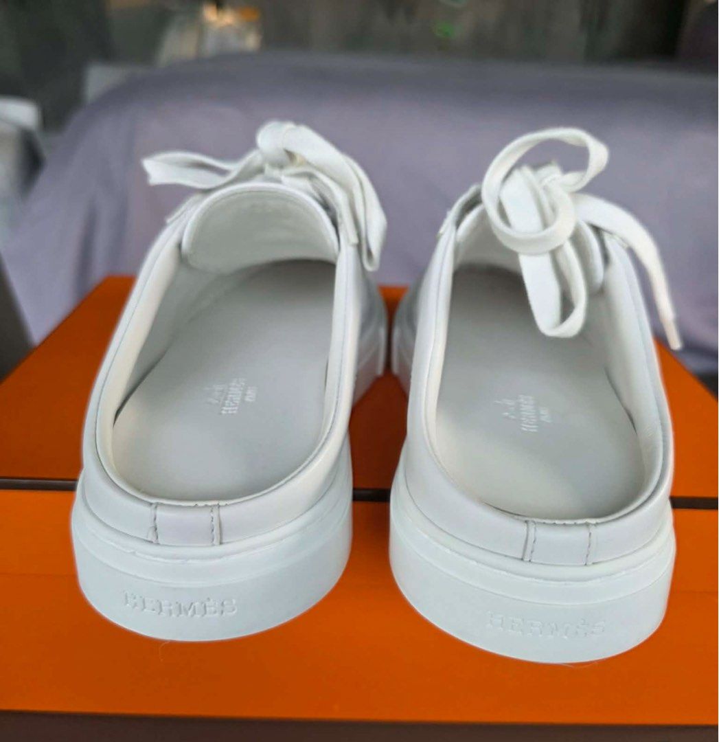 Hermès Keep Sneaker Mules White (Category: Sneakers & Footwear) located in Makati City. Submitted by goodconditionguaranteed (Listing ID 1466303862, Image 3). Description: - Brand: Hermès - Model: Keep Sneaker Mules - Color: Crisp White - Material: Premium Calfskin - Design: Slip-on with lace-up front and iconic tonal H stitching - Origin: Made in Italy - Inclusions: Original orange box and dust bag - Condition: Soles show minor signs of wear, we
