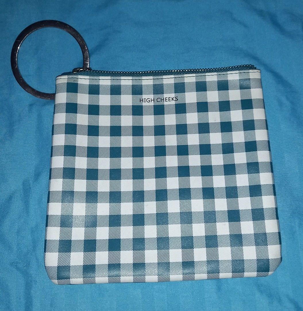 High Cheeks Pouch Fried Egg Gingham (Category: Purses & Pouches) located in Cagayan de Oro. Submitted by edwardryan01984 (Listing ID 1466167883, Image 2). Description: - Brand: High Cheeks - Design: Playful fried egg appliqué with deep teal faux leather front and green gingham check back - Hardware: Sturdy metal ring on the zipper corner for keys or wrist carrying - Closure: Smooth top zipper to keep your small essentials secure - Condition: Exce