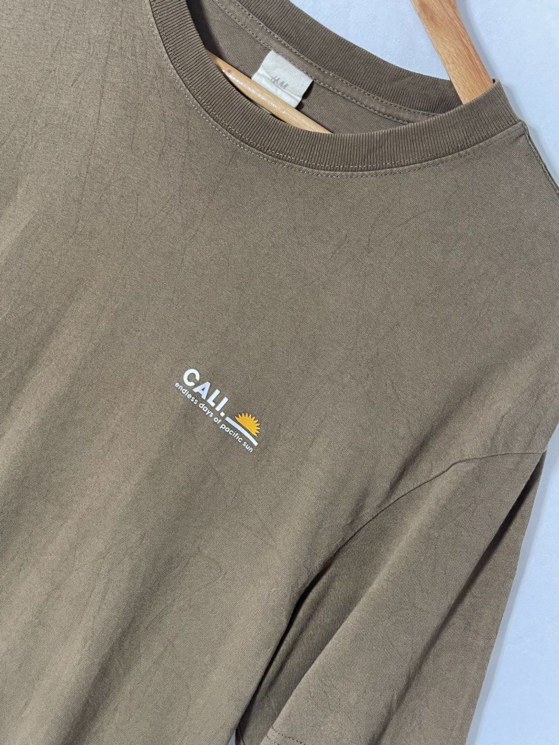 H&M Brown Cali Minimalist Shirt (Category: Tshirts & Polo Shirts ) located in Imus. Submitted by mochi.rella (Listing ID 1466258356, Image 2). Description: Brown H&M Cali Excellent Condition S on tag | Fit M W 21 | L 30.5 .