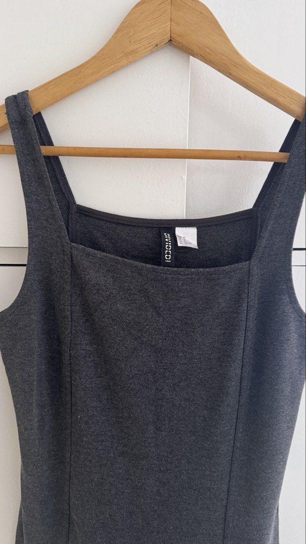 H&M Divided Grey Square Neck Mini Dress Size 12 (Category: Dresses) located in Quezon City. Submitted by meezck (Listing ID 1466185092, Image 1). Description: - Brand: H&M Divided - Color: Grey - Size: US 12 / EUR 42 - Design: Square neckline with thick tank straps - Fit: Fitted bodice with vertical panel seams and flared ruffle hem - Style: Simple slip-on, ideal for everyday casual wear - Condition: Excellent / Pre-loved.