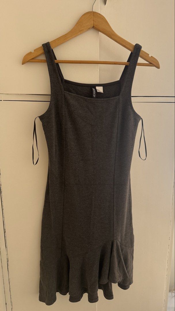 H&M Divided Grey Square Neck Mini Dress Size 12 (Category: Dresses) located in Quezon City. Submitted by meezck (Listing ID 1466185092, Image 3). Description: - Brand: H&M Divided - Color: Grey - Size: US 12 / EUR 42 - Design: Square neckline with thick tank straps - Fit: Fitted bodice with vertical panel seams and flared ruffle hem - Style: Simple slip-on, ideal for everyday casual wear - Condition: Excellent / Pre-loved.
