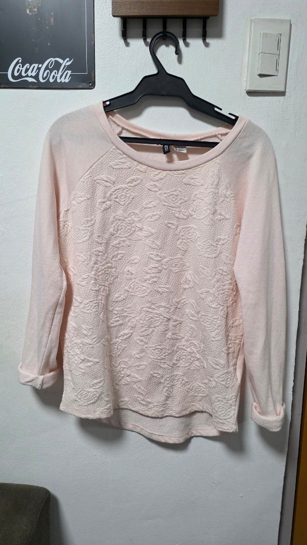 H&M Divided Pink Floral Sweatshirt (Category: Coats, Jackets and Outerwear) located in Pasig City. Submitted by jannetteg (Listing ID 1466218951, Image 2). Description: - Brand: H&M Divided - Color: Pink - Size: Tagged US XS (fits up to L) - Measurements: Up to 36" bust, 32" waist - Material: Cotton stretch fabric with embedded floral design on front - Details: Stitched cuffs - Price: ₱350 only - Promo: Bundle deal available - 3 items for ₱1,000 