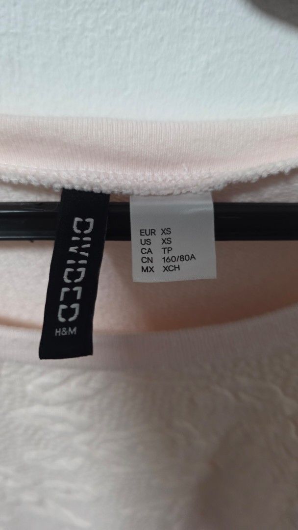 H&M Divided Pink Floral Sweatshirt (Category: Coats, Jackets and Outerwear) located in Pasig City. Submitted by jannetteg (Listing ID 1466218951, Image 3). Description: - Brand: H&M Divided - Color: Pink - Size: Tagged US XS (fits up to L) - Measurements: Up to 36" bust, 32" waist - Material: Cotton stretch fabric with embedded floral design on front - Details: Stitched cuffs - Price: ₱350 only - Promo: Bundle deal available - 3 items for ₱1,000 
