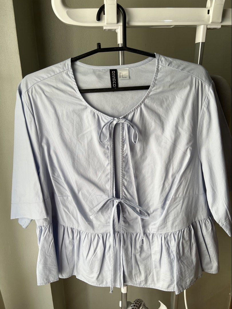 H&M Light Blue Tie-Front Peplum Blouse (Category: Blouses) located in Davao. Submitted by bengscloset (Listing ID 1466206006, Image 1). Description: Brand: Divided by H&M Color: Light blue Size: L Condition: Clean and well-kept 📌 No rush shipping. 📦 Shipping fee c/o buyer. 📍Davao City 💌 Feel free to message me for additional photos/details. Thank you for checking out my listing! ♡.