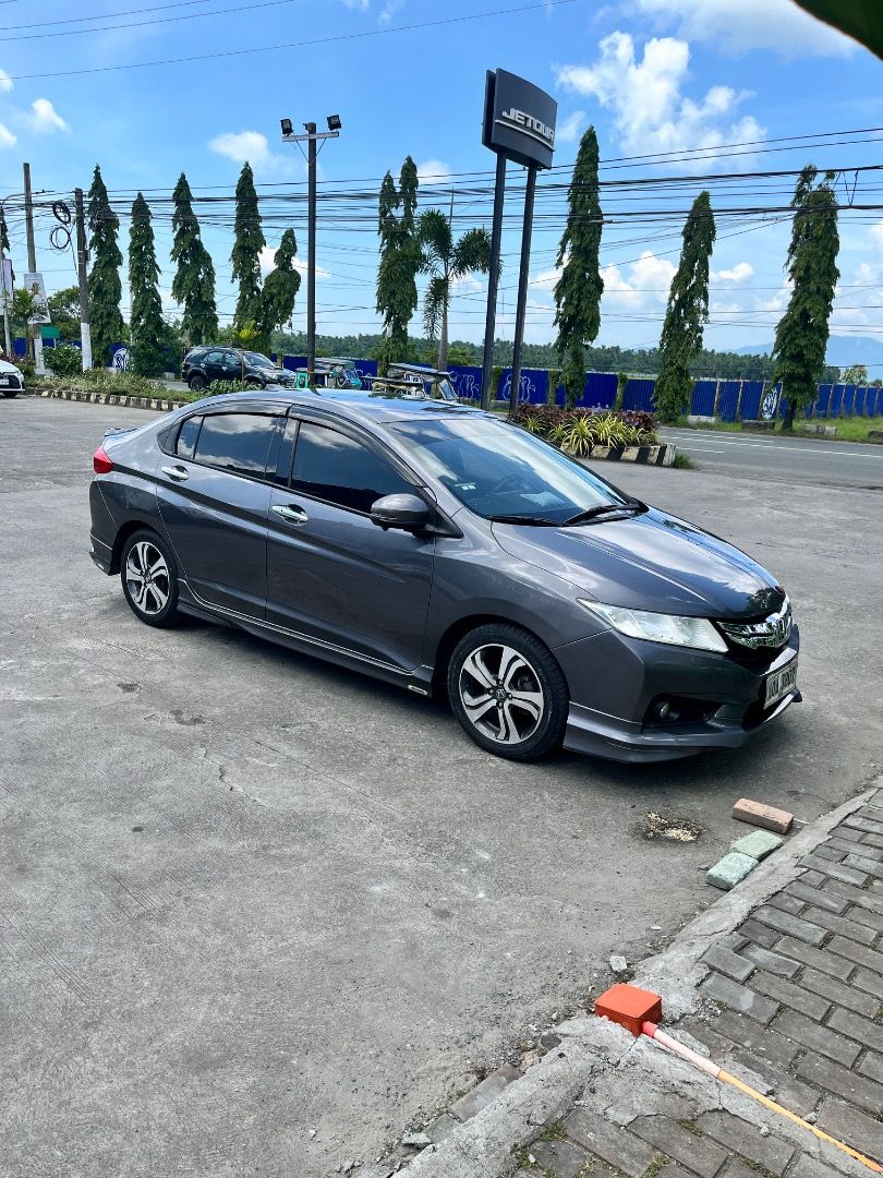 Honda City 1.5 VTEC (A) (Category: Used Cars) located in Caloocan City. Submitted by krstnkslpl (Listing ID 1466259097, Image 2). Description: HONDA CITY VX 2014 TOP OF THE LINE PUSH START WITH MODULO BODY KITS AND DUCKTAIL ALL LED LIGHTS UPGRADED LEATHER SEAT COVER TAKORA HEAD UNIT 4+64 Gb with Sony 360 Camera Ceramic Coated 117k Original mileage Brandnew tires Prod Date June 2026 (BF GOOD RICH) PAGSANJAN LAGUNA LOC PRICE IS NEGOTIABLE OPEN FOR 