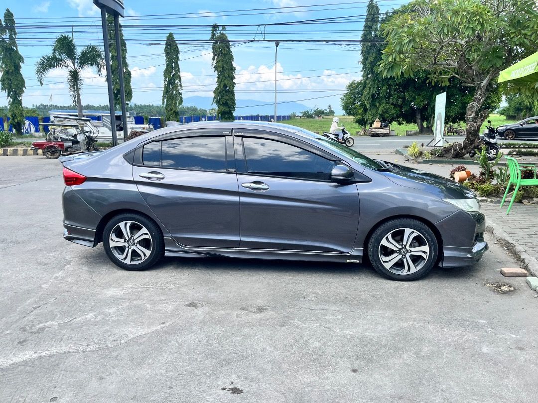 Honda City 1.5 VTEC (A) (Category: Used Cars) located in Caloocan City. Submitted by krstnkslpl (Listing ID 1466259097, Image 1). Description: HONDA CITY VX 2014 TOP OF THE LINE PUSH START WITH MODULO BODY KITS AND DUCKTAIL ALL LED LIGHTS UPGRADED LEATHER SEAT COVER TAKORA HEAD UNIT 4+64 Gb with Sony 360 Camera Ceramic Coated 117k Original mileage Brandnew tires Prod Date June 2026 (BF GOOD RICH) PAGSANJAN LAGUNA LOC PRICE IS NEGOTIABLE OPEN FOR 
