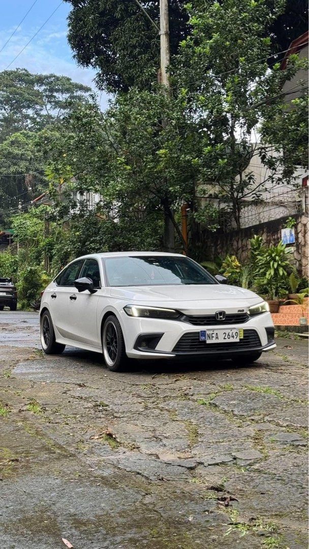 Honda Civic RS Turbo Auto (Category: Used Cars) located in Manila. Submitted by quality_cars (Listing ID 1466278078, Image 2). Description: FOR SALE ONLY ( NO TRADES ) Honda Civic RS Turbo 2023 model - Platinum White Pearl. 60k+ mileage ( well maintained. ) Price: ₱1,038,000 slight nego. Upgrades worth 100k Blue Ceramic Tint 2 Bosch Horns VLF Mags Hippo-tech Weather Mattings Blitz Strut Bar - Comes with 2 Original Keys - Complete with Manual and 