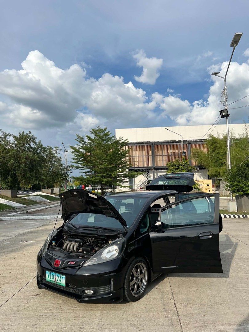 Honda Jazz 1.5 RS Hatchback (A) (Category: Used Cars) located in Manila. Submitted by kwekwekwek (Listing ID 1466308703, Image 2). Description: Honda Jazz 2013 RS Orig mmc Top of the line Paddle Shifter Pristine condition 1.5L engine Automatic Transmission 4 wheel disc brakes Fuel efficient 82k Original Low mileage Casa record Newly PMS honda TE 37 16s mags 90% tires Ceramic tint No issue Complete legal documents Registered Cauayan City Isabela 0