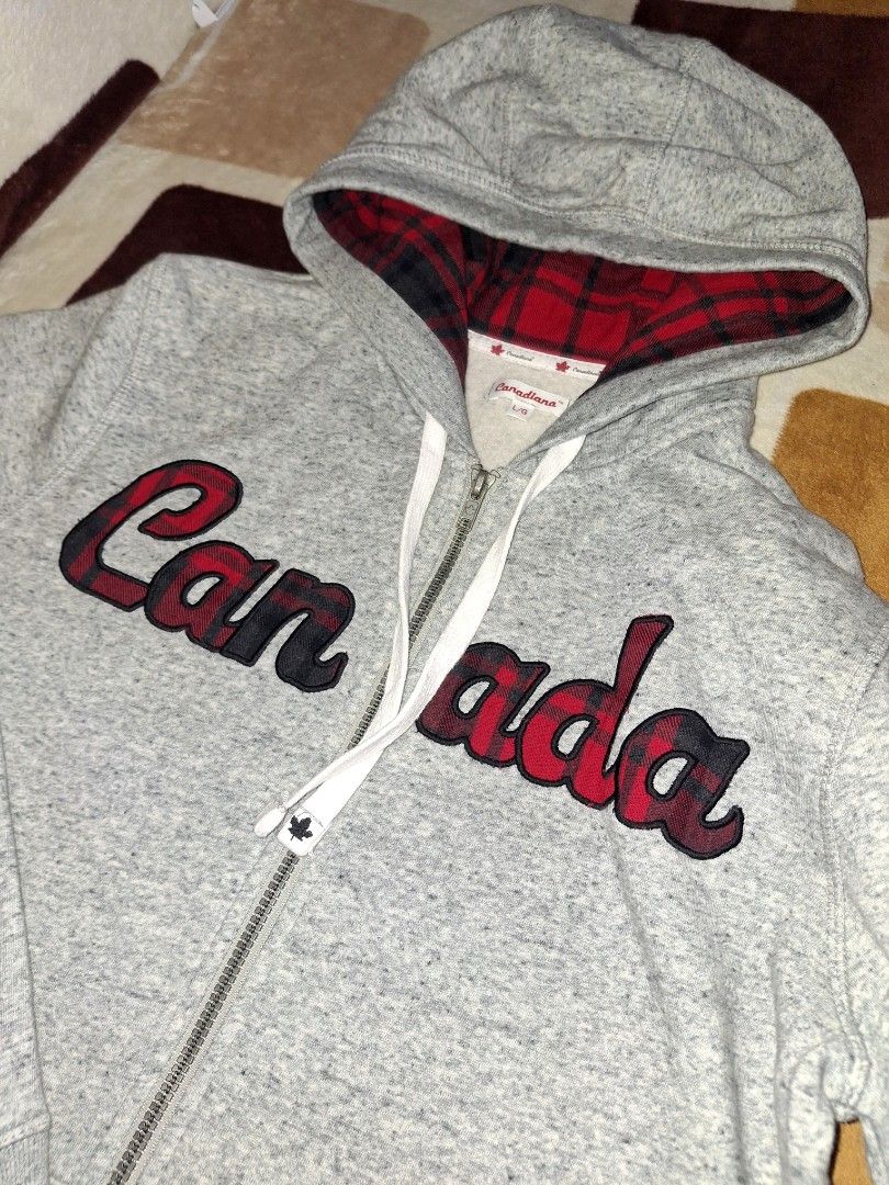 Hoodie Jacket Canada Plaid L (Category: Coats, Jackets and Outerwear) located in Manila. Submitted by jilliese (Listing ID 1466158456, Image 3). Description: branded like new size: large pickup loc: Baesa Caloocan - Brand: Canadiana - Size: Large (L) - Color: Grey heather with red and black plaid accents - Design: Bold 'Canada' chest applique with plaid filling - Details: Plaid hood lining, white drawstrings with black maple leaf metal tips - Tri
