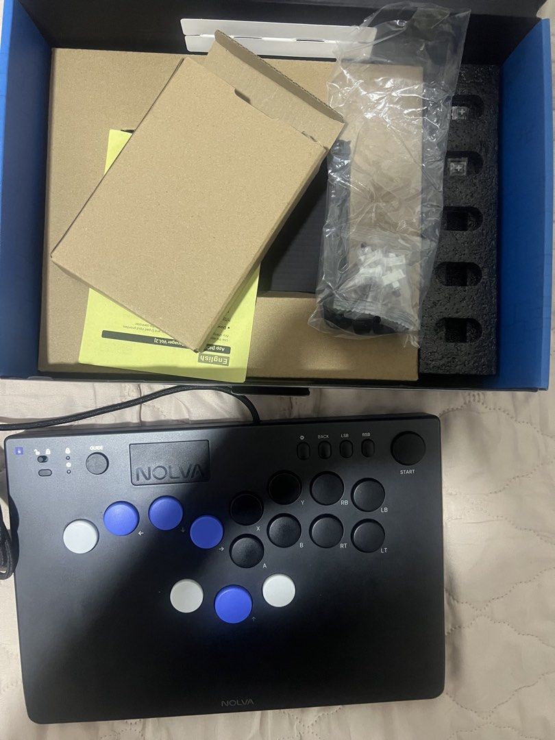HORI Nolva Mechanical All-Button Arcade Controller for Windows PC (Category: Controllers) located in Muntinlupa City. Submitted by mrzph (Listing ID 1466232459, Image 2). Description: - HORI Nolva mechanical all-button arcade controller for Windows PC - Sleek matte black finish featuring stylish white and blue buttons - Includes directional buttons, standard action buttons, and top utility buttons - Wired USB connection for lag-free gaming - Comp