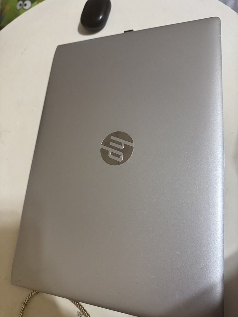 HP Silver Laptop (Category: Laptops & Notebooks) located in Manila. Submitted by avasantos (Listing ID 1466315928, Image 2). Description: - Sleek silver metallic lid with classic HP circular logo - Standard black keyboard with a wide, responsive trackpad - Built-in webcam equipped with a convenient privacy slider - Clean overall condition and ready to use - Ideal for online classes, work-from-home, and daily tasks - Message us for inquiries, last