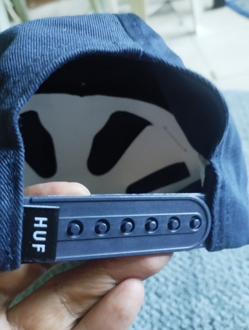 HUF Navy Blue Snapback Cap (Category: Caps & Hats) located in Manila. Submitted by happycaps (Listing ID 1466173299, Image 3). Description: - Brand: HUF - Style: 5-panel structured snapback cap - Color: Navy blue - Material: 100% cotton - Details: Embroidered HUF triangle logo on front - Closure: Adjustable matching plastic snapback with branded tag - Interior: Branded sweatband and intact care tags - Size: One size fits most - Origin: Made in Ch