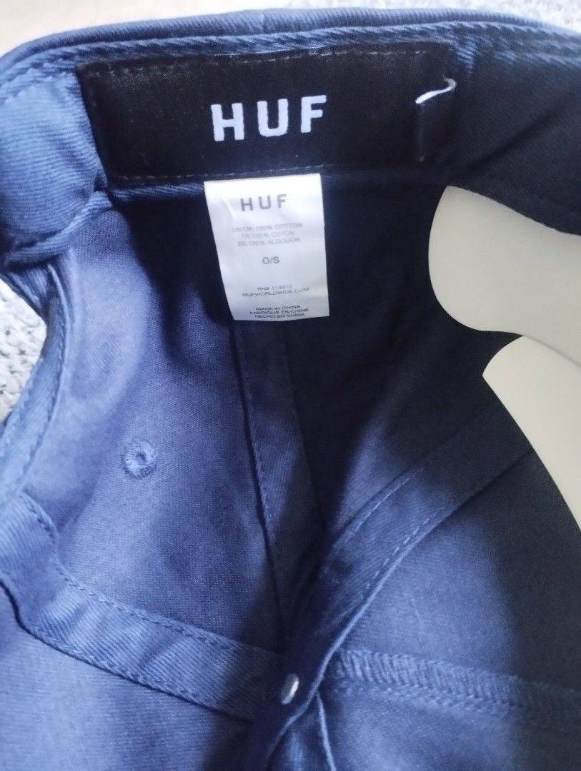 HUF Navy Blue Snapback Hat Cap (Category: Caps & Hats) located in Manila. Submitted by happycaps (Listing ID 1466172758, Image 3). Description: - Brand: HUF - Color: Navy Blue - Material: 100% Cotton twill - Design: Square woven patch logo on front - Fit: Adjustable plastic snap closure (One Size Fits All) - Condition: Clean fabric, great streetwear accessory.