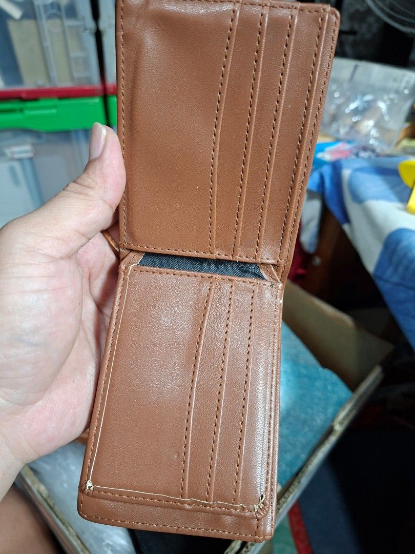 Hurley Brown Bi-Fold Leather Wallet (Category: Wallets & Card Holders) located in Lucena. Submitted by dai_suki (Listing ID 1466304993, Image 3). Description: Brown leather wallet from Hurley, debossed logo on the front. Plenty of card slots inside, plus a clear ID window and a zippered coin pocket. Main cash compartment is fabric lined. Good everyday size. 📌 Issue last pic po... JRS COURIER ONLY 1ST TO PAY.