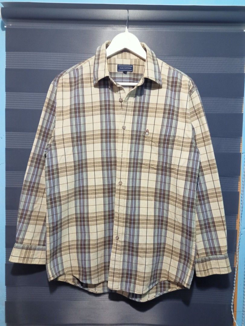 Hush Puppies Plaid Long Sleeve Button-Down Shirt (Category: Formal Shirts) located in Manila. Submitted by thecomftrift.co (Listing ID 1466324971, Image 2). Description: - Brand: Hush Puppies - Style: Long sleeve button-down shirt - Color/Pattern: Cream base with brown and blue plaid - Size: Medium (M) - Material: 100% cotton - Features: Chest pocket with signature embroidered dog logo, pointed collar, and standard button cuffs - Condition: Excel