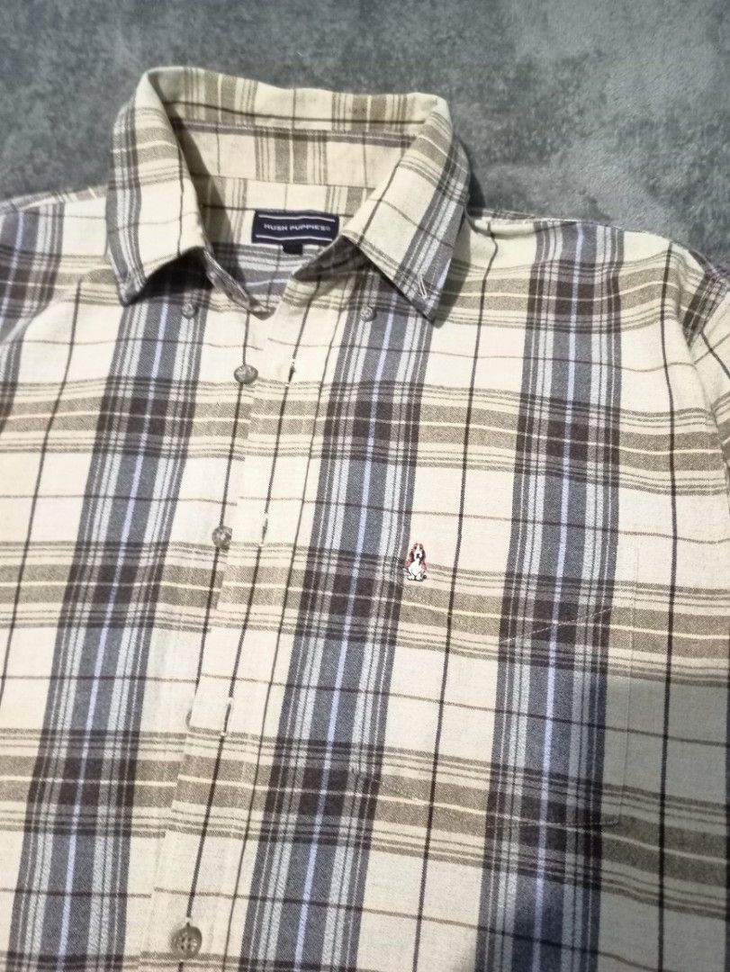 Hush Puppies Plaid Long Sleeve Button-Down Shirt (Category: Formal Shirts) located in Manila. Submitted by thecomftrift.co (Listing ID 1466324971, Image 3). Description: - Brand: Hush Puppies - Style: Long sleeve button-down shirt - Color/Pattern: Cream base with brown and blue plaid - Size: Medium (M) - Material: 100% cotton - Features: Chest pocket with signature embroidered dog logo, pointed collar, and standard button cuffs - Condition: Excel