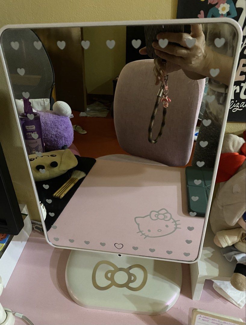 Impressions Vanity Hello Kitty Touch Pro LED Makeup Mirror (Category: Mirrors) located in Cavite. Submitted by momrocks (Listing ID 1466178761, Image 1). Description: Impressions Vanity Hello Kitty Touch Pro LED Makeup Mirror in pearl white. Key Features • Design: Features an iconic Hello Kitty bow graphic on the back and the character logo on the stand. • Lighting: Built-in daylight LED lighting strip with touch sensor controls to adjust brightn