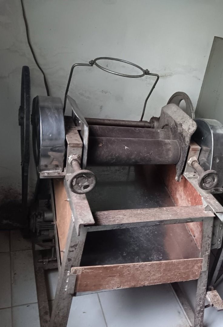 Industrial Heavy Duty Rolling Machine Metal Roller 2HP (Category: Bakeware) located in Makati City. Submitted by mannycollado (Listing ID 1466249859, Image 2). Description: - Heavy-duty with 2HP motor metal rolling machine - Features dual steel rollers and adjustable hand wheels - Mounted on a sturdy metal and wood frame stand - Industrial grade, ideal for metal sheet shaping or bakery dough flattening - Shows visible rust and cosmetic wear from 