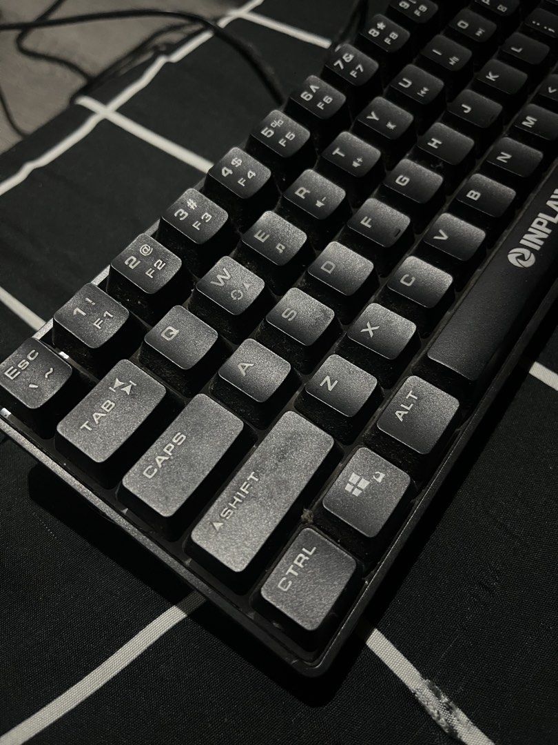 Inplay Black Gaming Keyboard (Category: Computer Keyboard) located in Subic. Submitted by ninnooo (Listing ID 1466267495, Image 3). Description: - Brand/Model: Inplay compact keyboard - Color: Black - Layout: Standard compact layout (numbers accessible via function keys) - Condition: Fully working for typing and gaming; has minor dust from storage and needs a quick wipe down - Connectivity: Wired via attached cable - Fulfillment: Ready to ship or