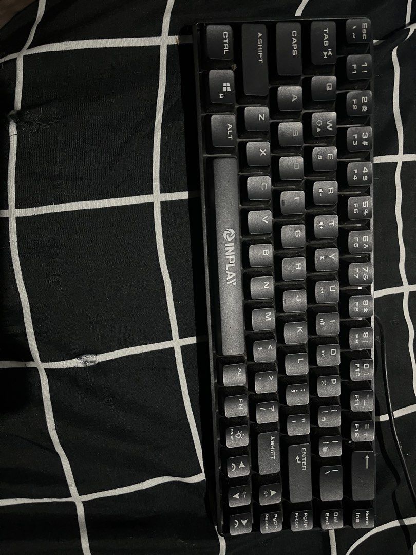 Inplay Black Gaming Keyboard (Category: Computer Keyboard) located in Subic. Submitted by ninnooo (Listing ID 1466267495, Image 1). Description: - Brand/Model: Inplay compact keyboard - Color: Black - Layout: Standard compact layout (numbers accessible via function keys) - Condition: Fully working for typing and gaming; has minor dust from storage and needs a quick wipe down - Connectivity: Wired via attached cable - Fulfillment: Ready to ship or